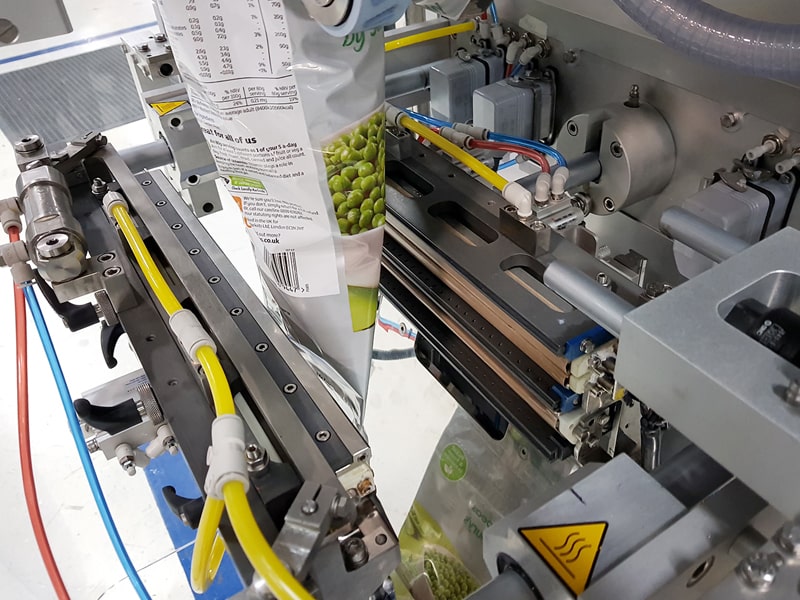 Flexible packaging machinery for pouch forming and sealing